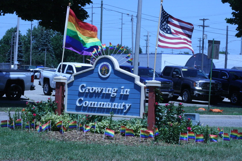 The pride flag makeover for the Eastside welcome sign and garden.