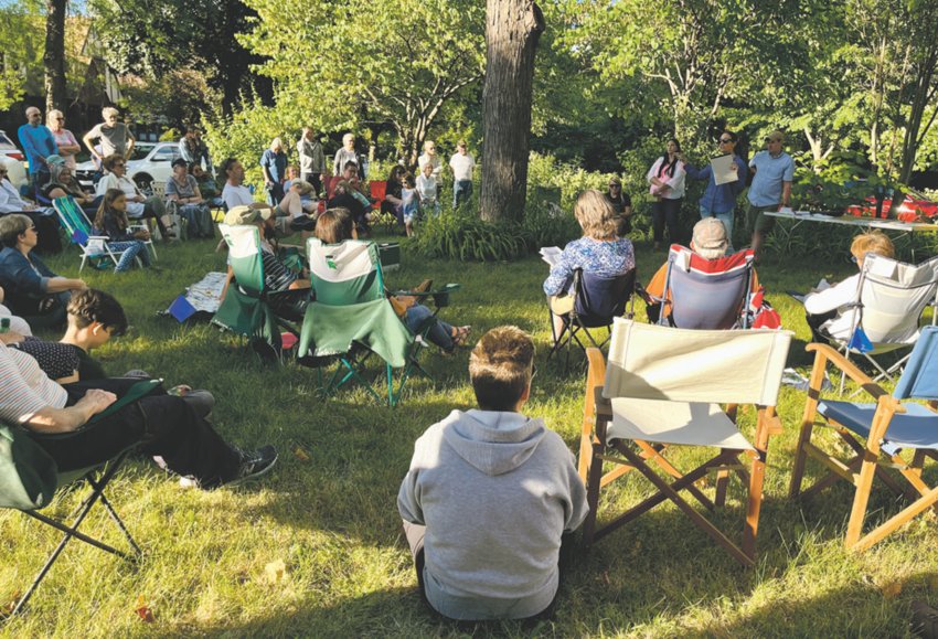 Residents gather in a traffic circle in the Westside Neighborhood Monday evening (June 27) to discuss concerns about how the city&rsquo;s Combined Sewer Overflow Project might affect their beloved islands.
