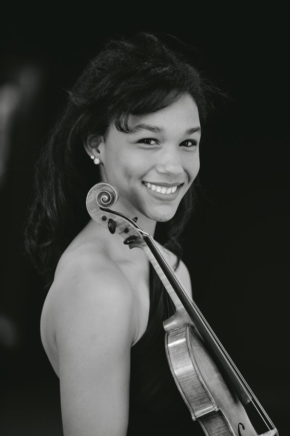 Violinist Ad&eacute; Williams plays Samuel Barger&rsquo;s violin concerto for the first time with the Lansing Symphony Orchestra Friday.