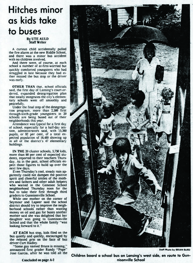 This story and photo from the front page of the Lansing State Journal on Sept.10, 1976, shows Penny Stump watching her 6-year old daughter, Heather, board a school bus to transport her from her home in the Westside Neighborhood to the Gunnisonville School on Wood Street in Dewitt Township. Stump was one of thousands of pupils who were bused in the 1960s and &lsquo;70s under a court order that sought to desegregate Lansing schools.