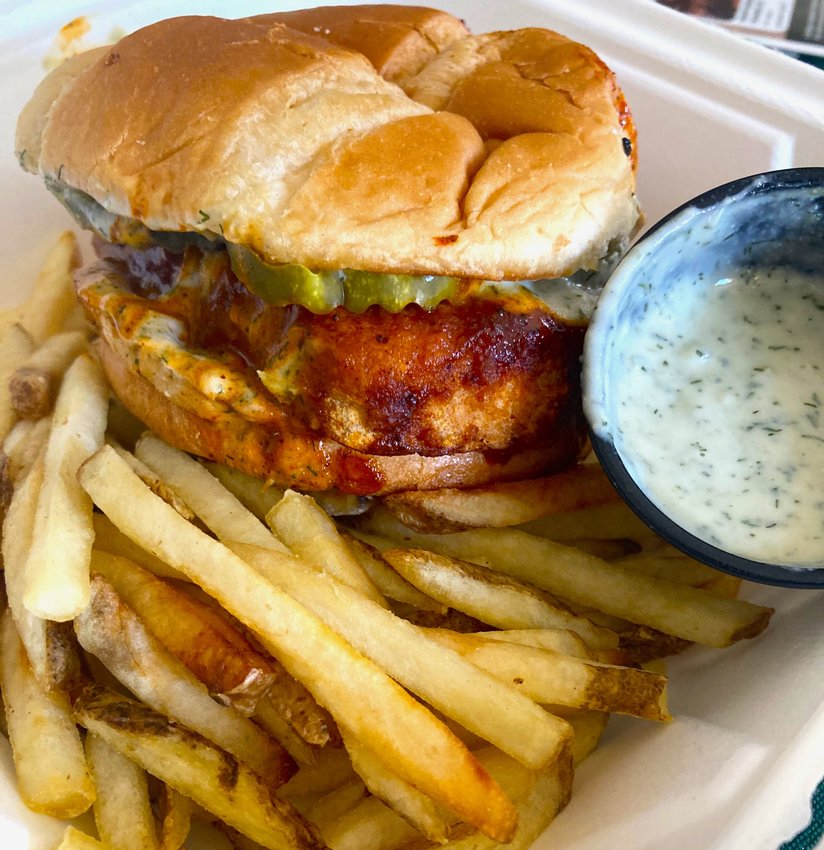 The Nashville Tofu Sandwich comes with a hearty slab of extra firm tofu covered in Nashville hot sauce.