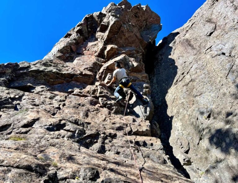 A climber navigating Slugg&rsquo;s Bluff, the 80-foot-tall quartzite cliff that climbers have been enjoying since the 1970s.
