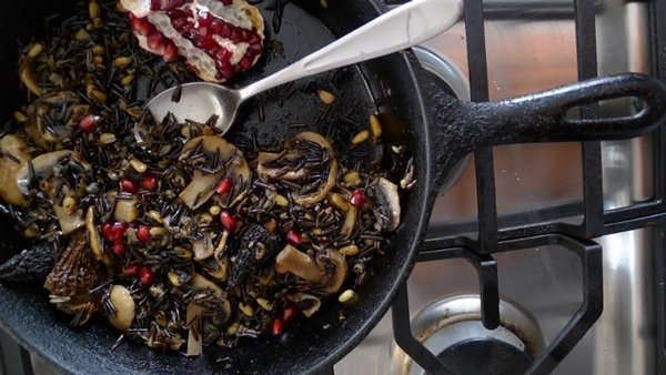 Wild rice with mixed mushrooms and pomegranate seeds, a one-pot meal that&rsquo;s as unique as it is delicious.