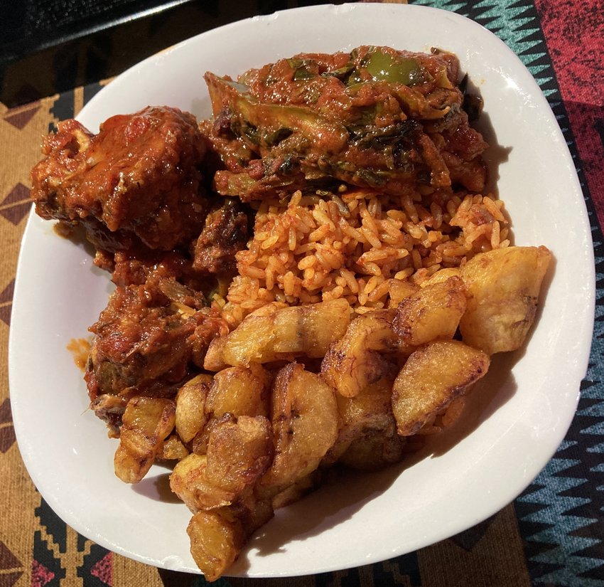 Tatse&rsquo;s goat bowl with jollof rice and fried plantains.