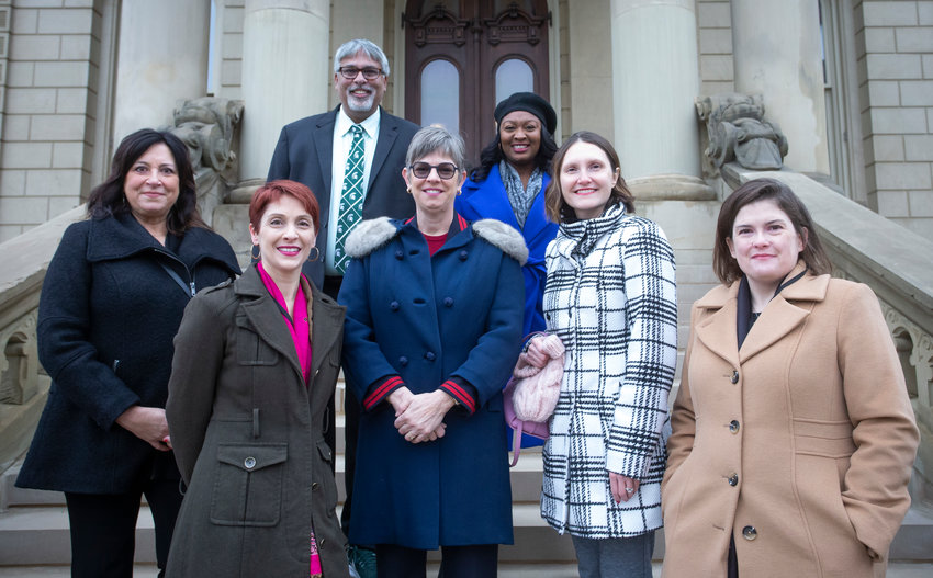 Mid-Michigan&rsquo;s Democratic state legislators gathered at the Capitol on Jan. 1 for Gov. Gretchen Whitmer&rsquo;s inauguration. (From left): Rep. Angela Witwer of Eaton County; Rep. Emily Dievendorf of Lansing; Sen. Sam Singh of East Lansing; Rep. Julie Brixie of Meridian Township; Sen. Sarah Anthony of Lansing; Rep. Penelope Tsernoglou of East Lansing; and Rep. Kara Hope of Holt.