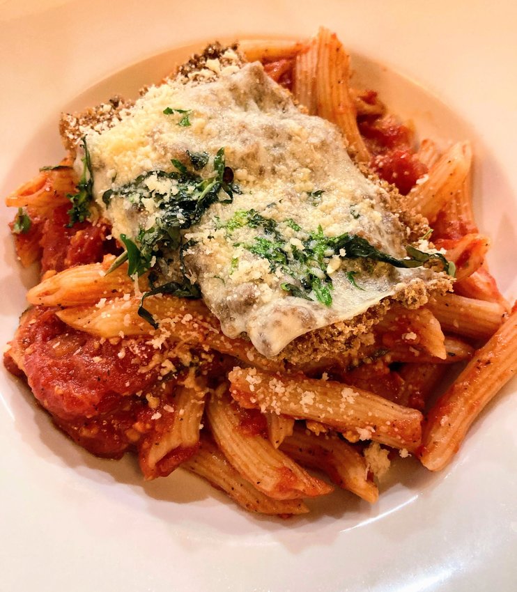 Tannin&rsquo;s crispy-yet-juicy chicken Parmesan sits atop a bed of penne dressed with bright, fresh-tasting marinara sauce, all topped with fragrant basil.