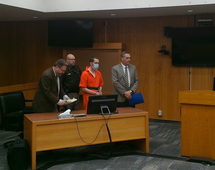 Joseph Sadlak flanked by his attorneys Conrad Vincent on the left and Daniel Pawlak far right, prepares to leave an Eaton County Circuit Courtroom where he entered a no contest plea to second degree murder in the 2018 killing of Clinton &quot;Billy&quot; Decker.