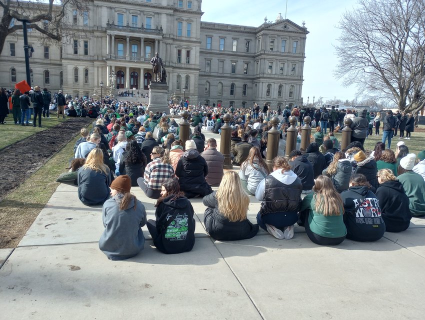 Michigan State University students at the Michigan Capitol building demanding change to gun laws.