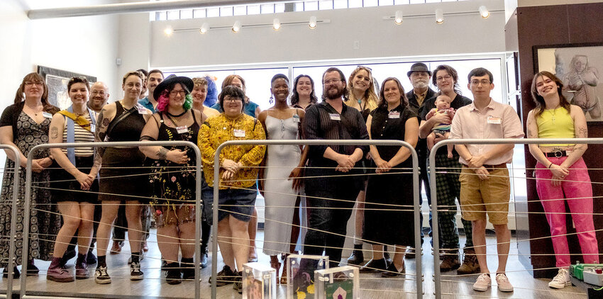 The artists behind &ldquo;The LGBTQ+ Artist in Michigan&rdquo; pose for a group photo at the exhibition&rsquo;s May 11 opening reception.