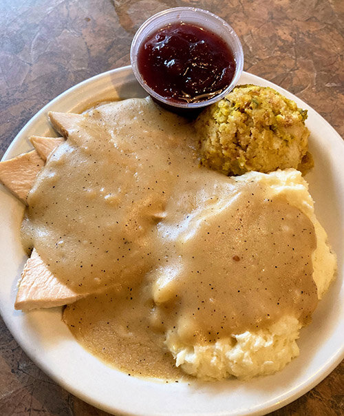 Lizy Ferguson/City Pulse  At Coral Gables in East Lansing, you don&rsquo;t have to wait for Thanksgiving to order a turkey dinner with gravy, stuffing, mashed potatoes and cranberry sauce.