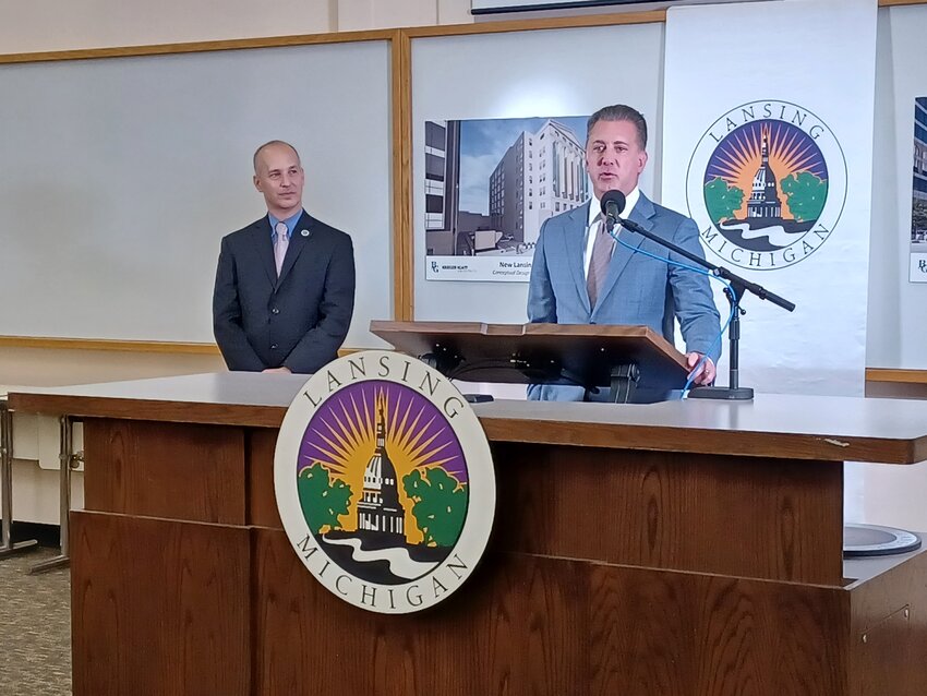 Lansing Mayor Andy Schor (left) at the press conference today with Ron Boji of the Boji Group on the second floor of the old Masonic Temple announcing that the building will become City Hall if the City Council approves.