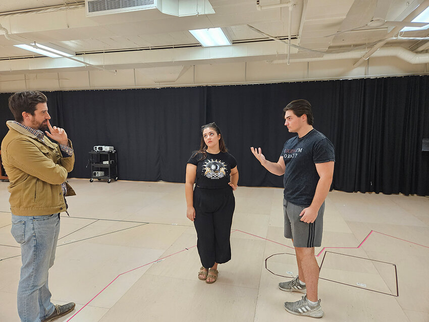 Director Ryan Patrick Welsh (left) and cast members Seray Sezgen (center) and Tyler Radze block a scene for Michigan State University&rsquo;s production of &ldquo;Clue.&rdquo;