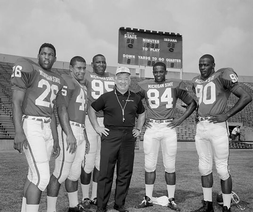 Coach Duffy Daugherty (center) worked to recruit Southern Black players to Michigan State University&rsquo;s football team in the mid-1960s.
