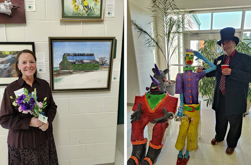 Marlene Epley (left) and Scott Van Allsburg, members of the Art Williamston gallery&rsquo;s Board of Directors, pose with art they created for the gallery&rsquo;s first exhibition, &ldquo;Unveiling Our Heritage: Introducing Artists of Williamston.&rdquo;
