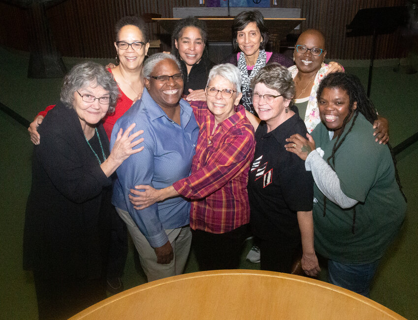 Members of Voices of the Revolution, alongside pianist and composer Adrienne Torf and local singers Shelia Burks and Rose Jangmi Cooper, take a break from rehearsing for their Friday (Nov. 10) performance to pose for a group photo. Back row, from left: Kim Griffin, Lisa Sarno, Torf, Burks. Front row, from left: Ruelaine Stokes, Susan Harris, Tari Mu&ntilde;iz, Laurie Hollinger, Cooper.