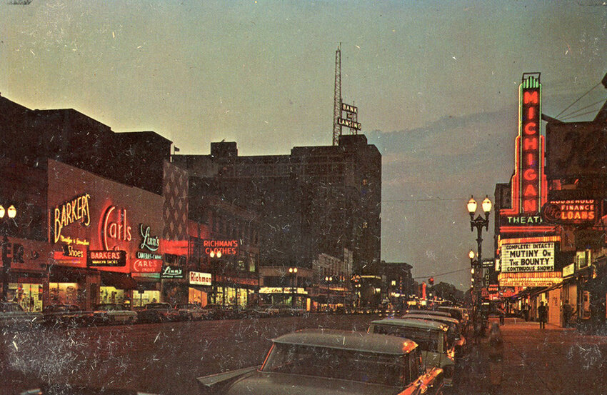 A view of a thriving downtown Lansing in 1962, looking north on what was then Washington Avenue, now Washington Square. The old Bank of Lansing building on the upper left is the home of Comerica Bank today.