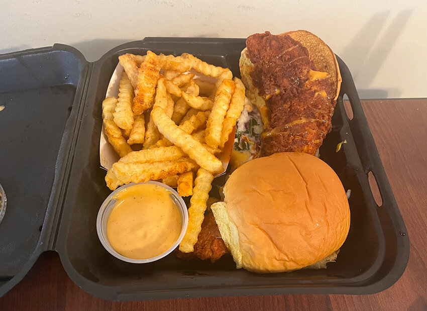 Dave’s Hot Chicken’s sliders-and-fries combo features two perfectly cooked 
fried chicken sandwiches and a side of savory, crispy crinkle-cut fries.