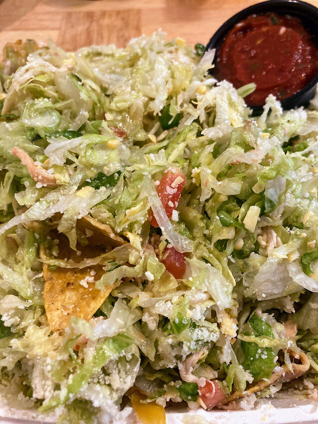 El Azteco East&rsquo;s massive topopo salad, served on a bed of what is essentially nachos, is a must-try for those who are unfamiliar.