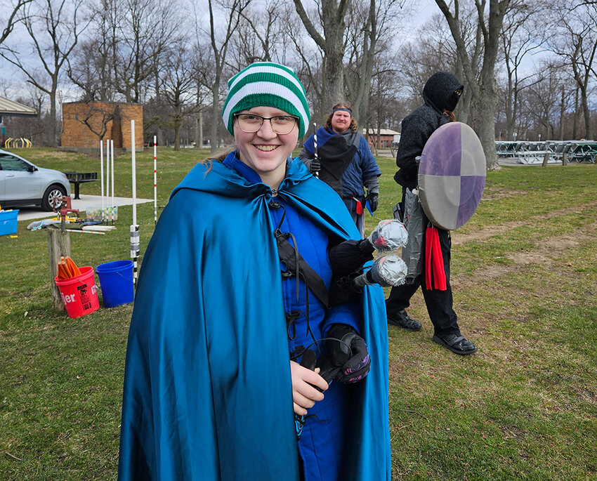 Isabel, 15, a member of Lansing&rsquo;s Amtgard chapter, the Duchy of Ashen Hills, smiles before heading into battle at Patriarche Park last Sunday (March 17).