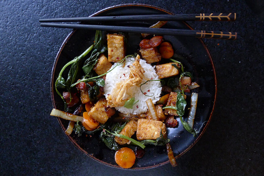 A stir-fry of pea shoots, carrots, salad turnips and marinated restaurant tofu.