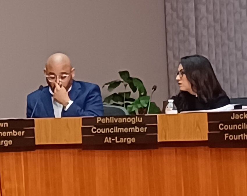 At-large Council members Jeffrey Brown (left) and Trini Pehlivanoglu at a March City Council meeting. They were two of four Council members whose actions may have upset years of planning for a new city hall.