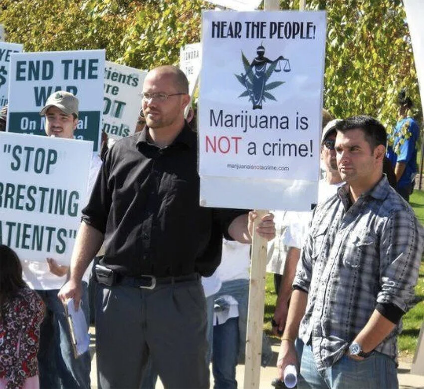 A 2010 caregiver-rights protest rally in Lansing. Ryan Basore (left), who owns Redemption Cannabis, served time in federal prison for marijuana-related activities. Mark Passerini (right) owned an Ann Arbor dispensary.