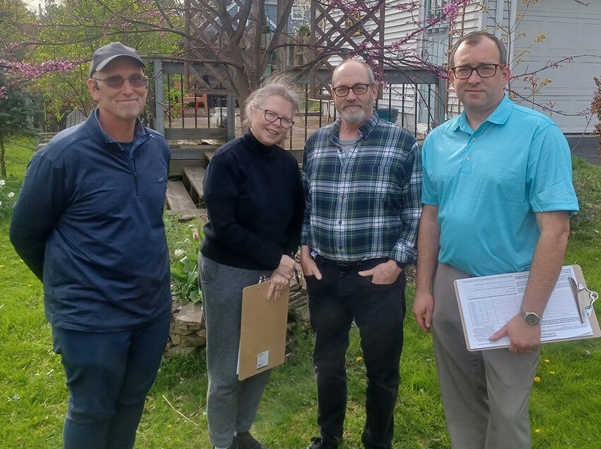 (From left) Patrick Rose, Susan Froetschel, Doug Olsen and Mike French are among East Lansing residents petitioning to put a charter amendment on the ballot to prohibit the city from limiting the number of unrelated people that homeowners may let live with them.