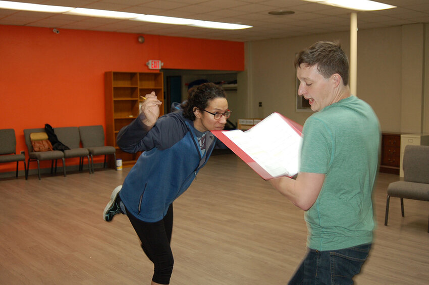 Ann Carlson (left) and Rich Kopitsch rehearse a fight scene for “Not Part of the Choreography,” one of nine short plays featured in Ixion Ensemble Theatre’s new works showcase “Let’s Fight,” running May 10, 11, 17 and 18 at Stage One at Sycamore Creek Eastwood.