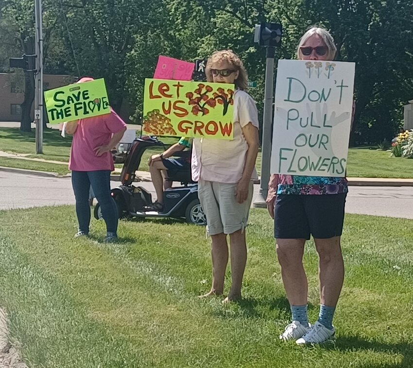 Residents of Grange Acres,  a subsidized senior citizens apartment complex in Haslett, protesting an order to eliminate their private gardens.
