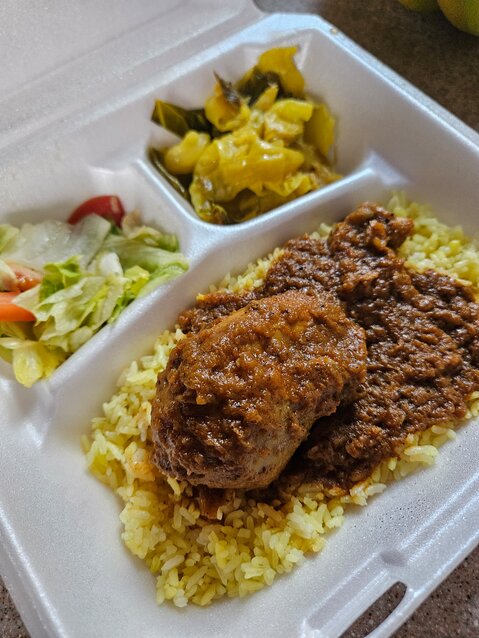 The chicken stew at Altu’s, paired with its famous cabbage and a tart, vinegary salad, elevates the reliable comfort-food combination of chicken and rice.