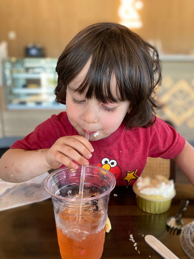 The author’s child enjoys a dragonfruit refresher at Moka & Co.’s new location in Okemos.