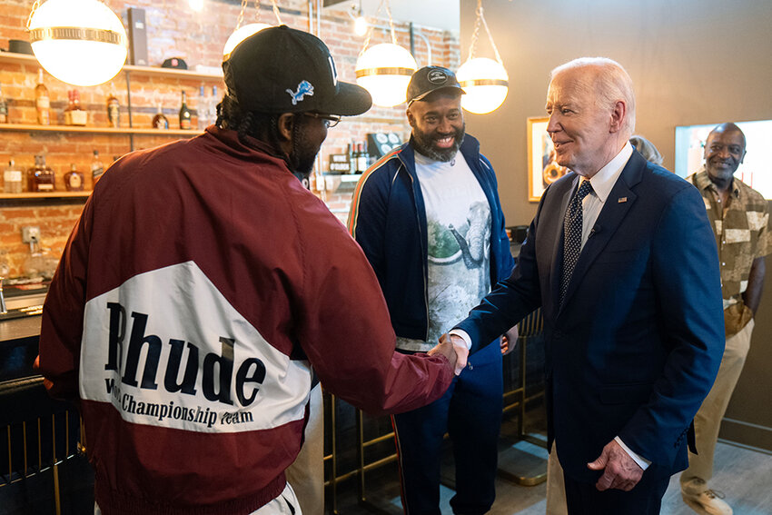 1st photo: (From left) Former NBA players and Detroit natives Jordan and Joe Crawford greet President Joe Biden at their new business, CRED Café in Detroit, during a stop on Biden&rsquo;s Michigan visit last month.