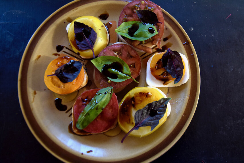 To add more vibrancy to your Caprese salad, try using both purple and green basil or different-colored tomatoes.