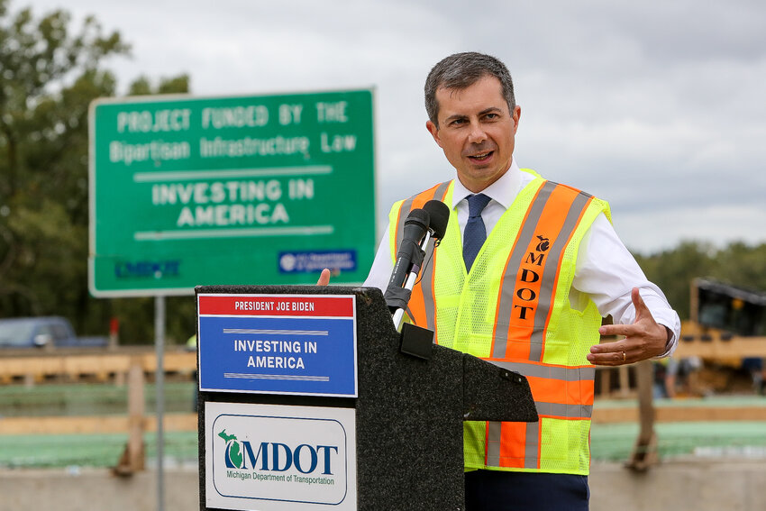 U.S. Transportation Secretary Pete Buttigieg touts President Joe Biden's bipartisan infrastructure law during a stop at the I-127/I-496 bridge construction site off Trowbridge Road in East Lansing.