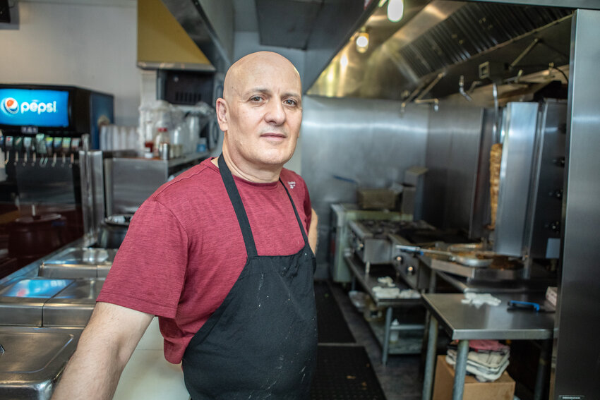 Ali Alkasti, owner-chef of Sahara Delight in downtown Lansing, is concerned about how changes in state law governing tipped employees will affect his business.