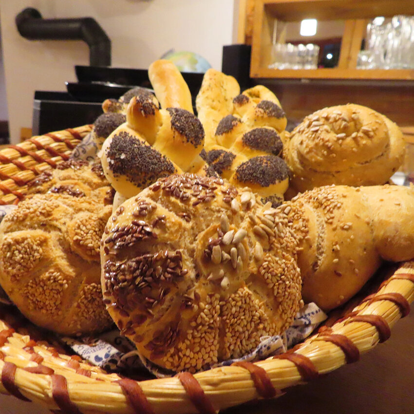 Seed-coated bread rolls, baked fresh by a farmer in the Austrian countryside.