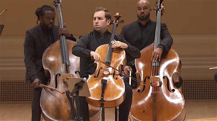 Tommy Mesa (center), featured soloist with the Lansing Symphony Orchestra on Thursday (Oct. 3), is the principal cellist of the Sphinx Virtuosi, a chamber ensemble of top Black and Latino musicians. The bassists are Chris Johnson (left) and Jonathan Colbert (right).