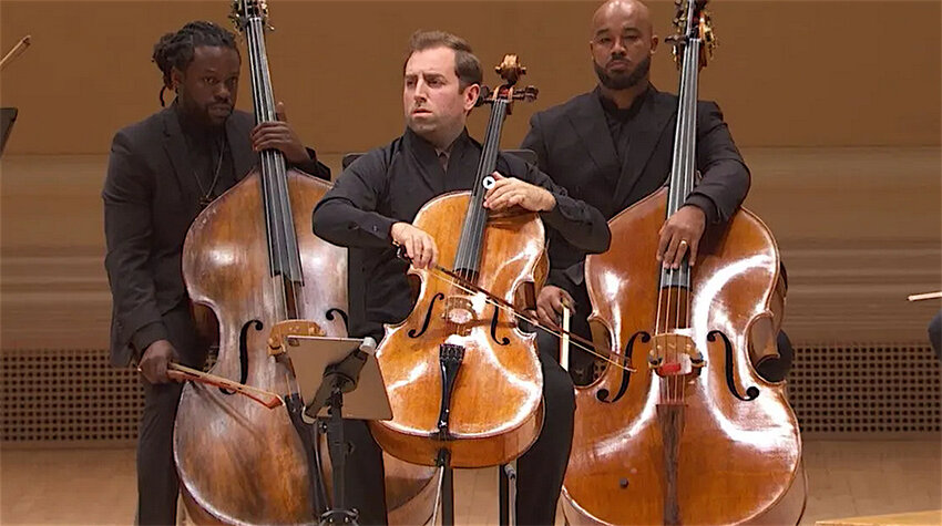 Courtesy photo  Tommy Mesa (center), featured soloist with the Lansing Symphony Orchestra on Thursday (Oct. 3), is the principal cellist of the Sphinx Virtuosi, a chamber ensemble of top Black and Latino musicians. The bassists are Chris Johnson (left) and Jonathan Colbert (right).