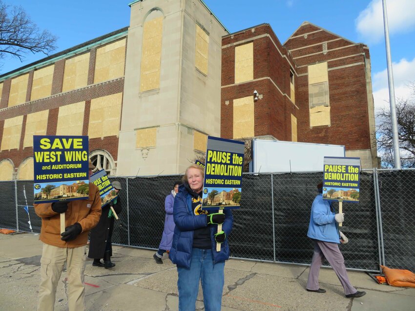 Protesters today in front of the west wing and auditorium of old Eastern High School, which they still hope to preserve even though demolition started Tuesday.