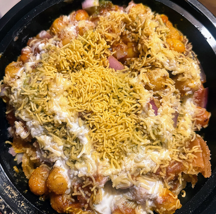 Curry House’s chaat samosa — a torn-apart samosa covered in chickpea curry, chutneys, yogurt sauce and crunchy chickpea-flour noodles — is a wallet-friendly option for those craving a variety of Indian flavors.