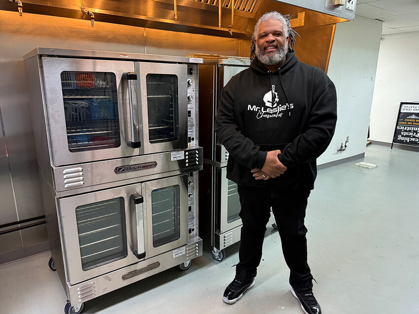 Marcus Leslie, owner of Mr. Leslie&rsquo;s Cheesecakes, shows off the ovens at the bakery&rsquo;s new Holt location.
