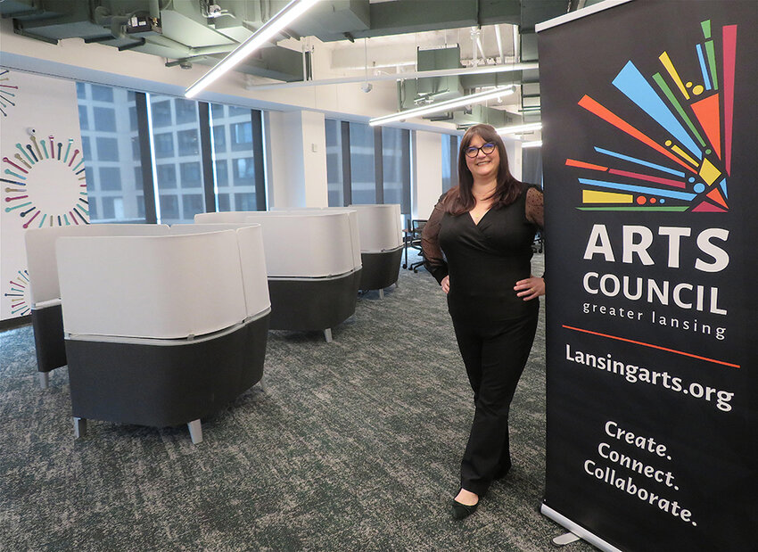 Meghan Martin, executive director of the Arts Council of Greater Lansing, shows off the council&rsquo;s new digs at MSU Federal Credit Union&rsquo;s Coworkerie in downtown East Lansing.
