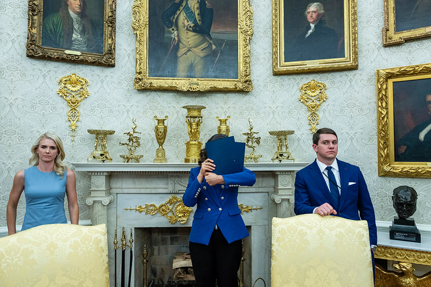 A thousand words? This exclusive New York Times photo from Saturday carried this caption: &ldquo;Gov. Gretchen Whitmer of Michigan found herself in the Oval Office this week not for a one-on-one meeting with President Trump, but an appearance before the press corps. She temporarily shielded herself from the cameras.&rdquo;