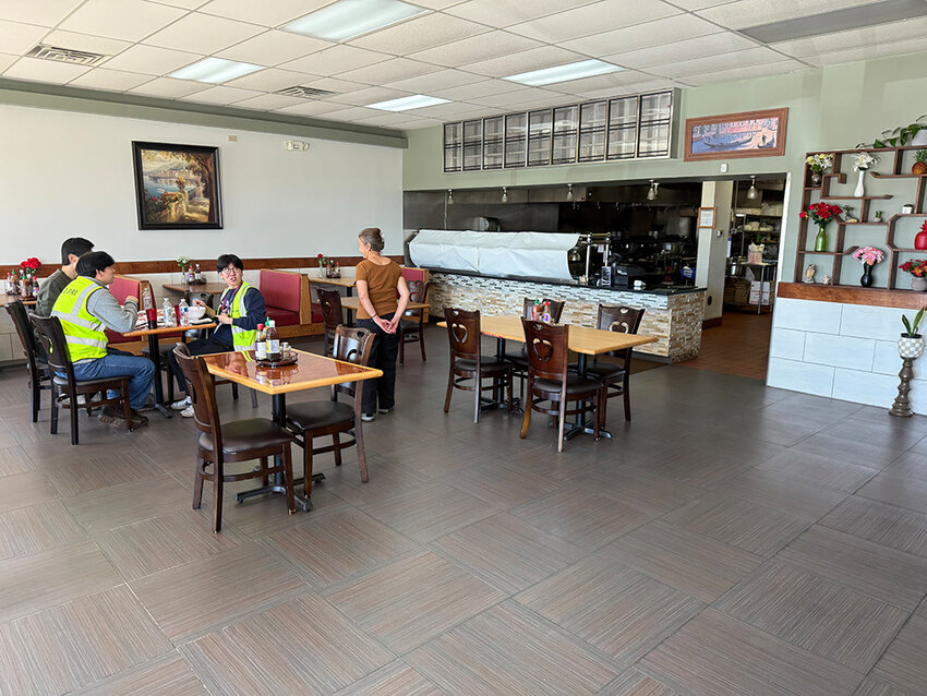 Maikou Vang chats with customers at her new Asian restaurant, MK Pho, which opened April 22.