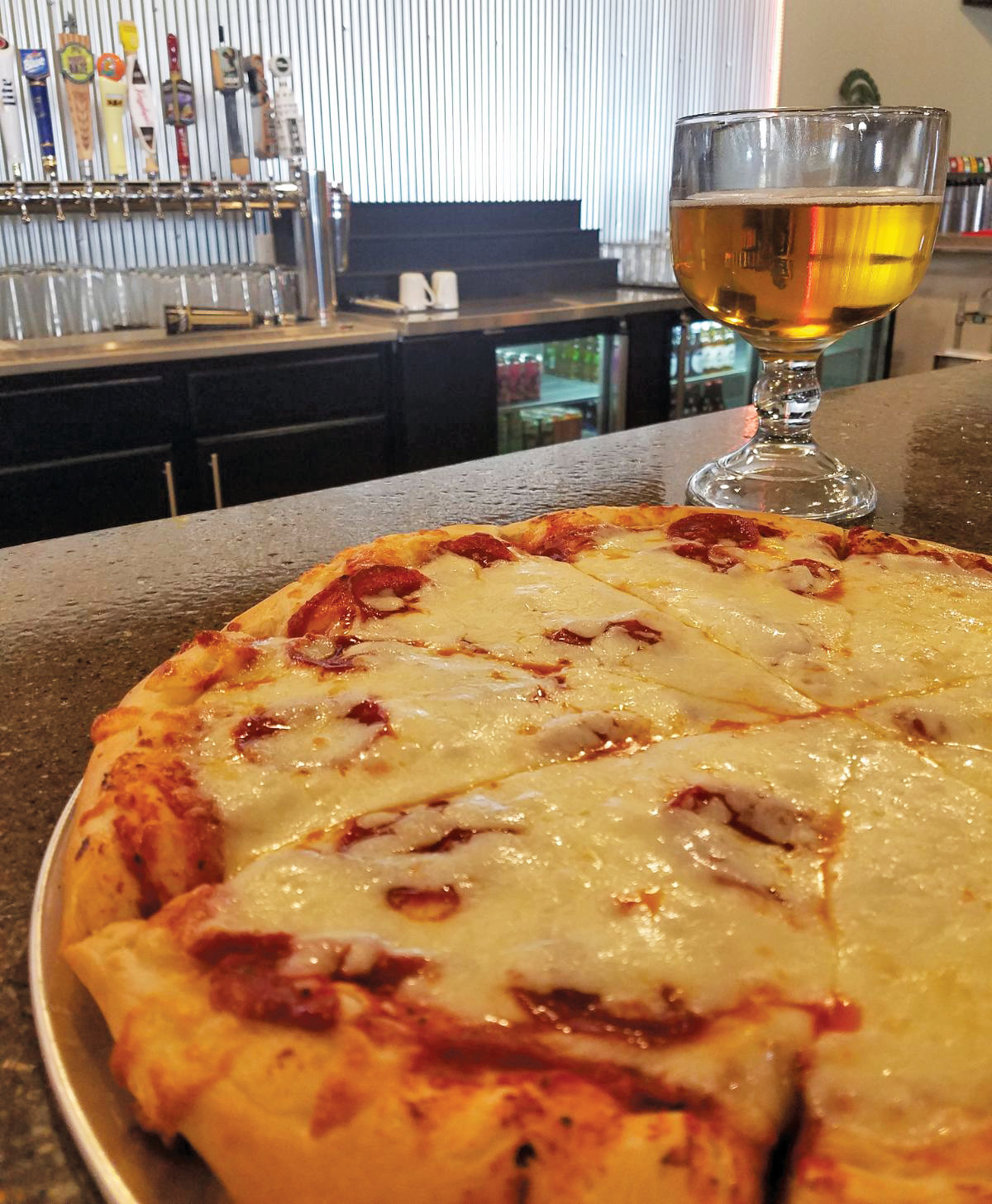 A classic combination: pizza and beer at Art's Pub.