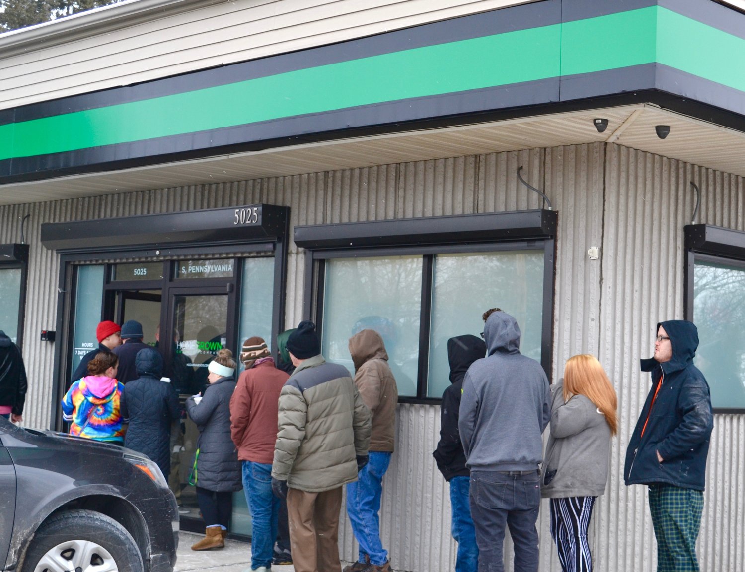 Customers line up outside of Homegrown Cannabis Co.