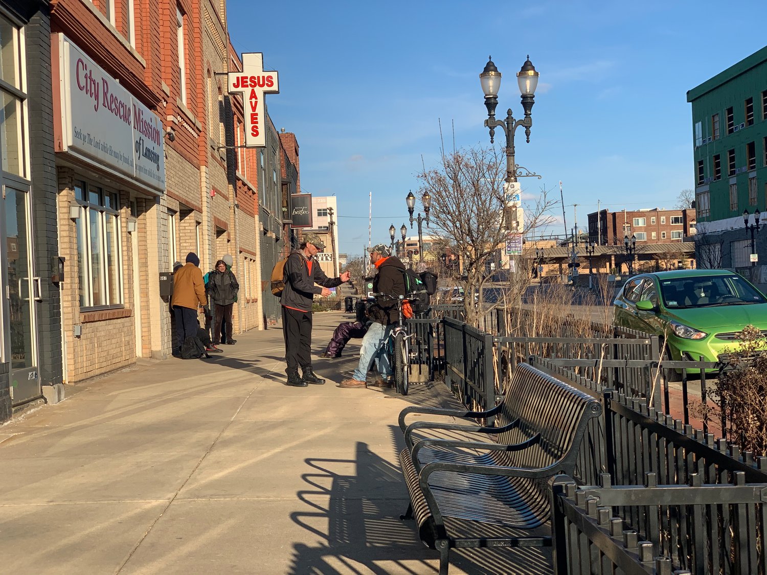 Several men gathered for meal service last month outside the City Rescue Mission on Michigan Avenue.