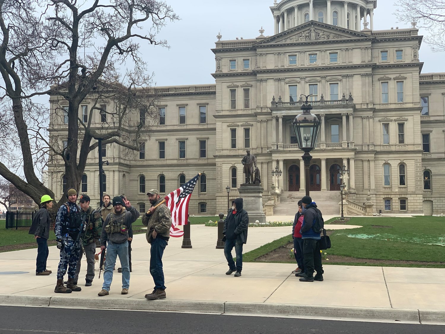 A small group of demonstrators gathered at the Michigan State Capitol today.