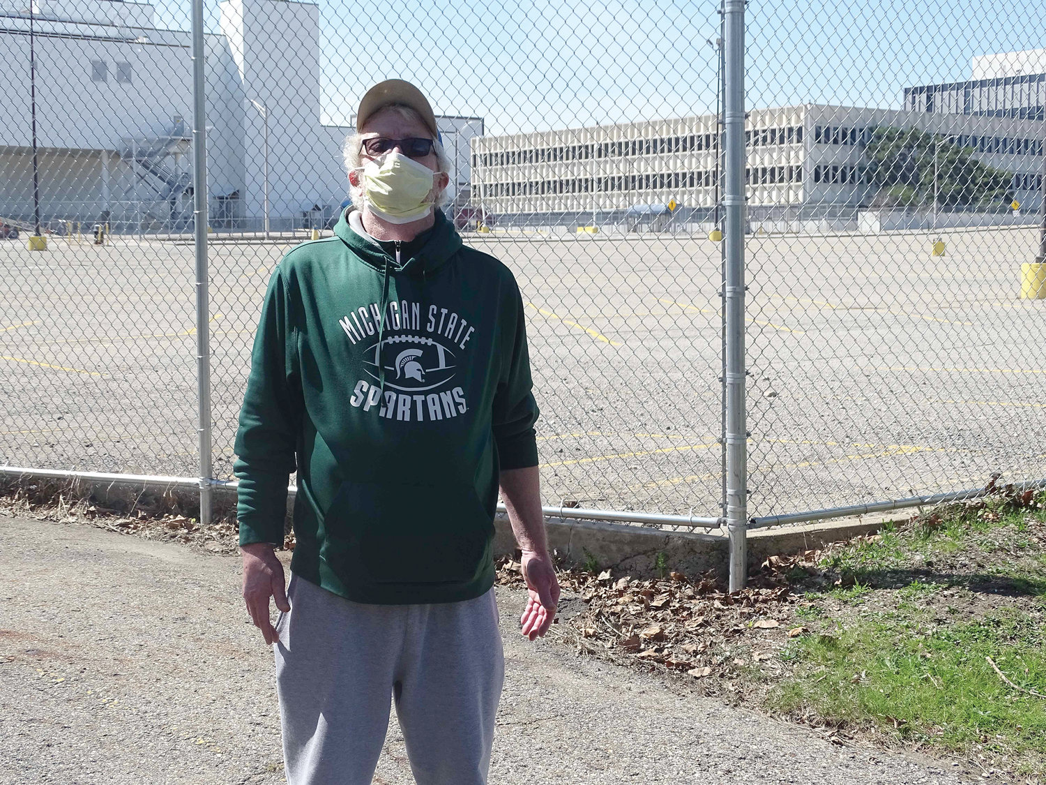 Bill Stephenson, a retired corrections officer, doesn't think people are taking the COVID-19 pandemic seriously enough. He retreated to the former Oldsmobile headquarters parking lot to keep his social distance Friday.