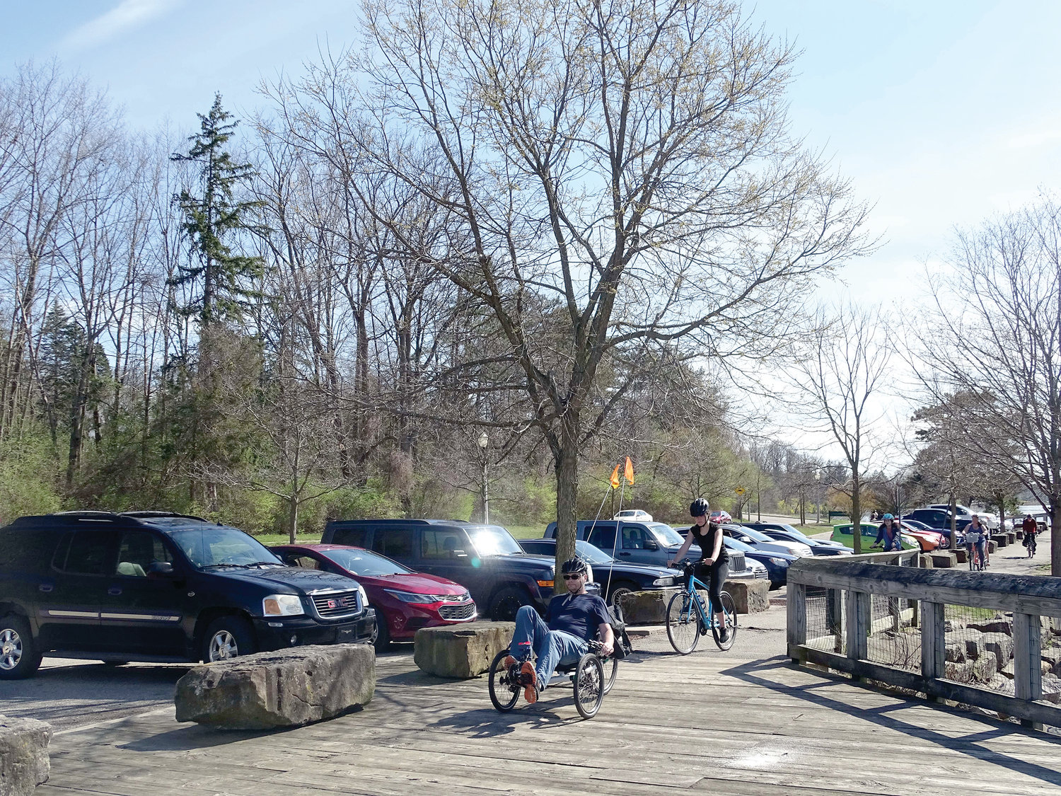 The riverside parking lot near Francis Park and adjoining trail were busy on the first warm Friday of spring.